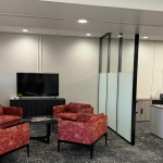 Demising wall with black wall frame finish and half height privacy window film #1746