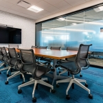 Glass conference room walls with privacy window film and black frame finish  #1734